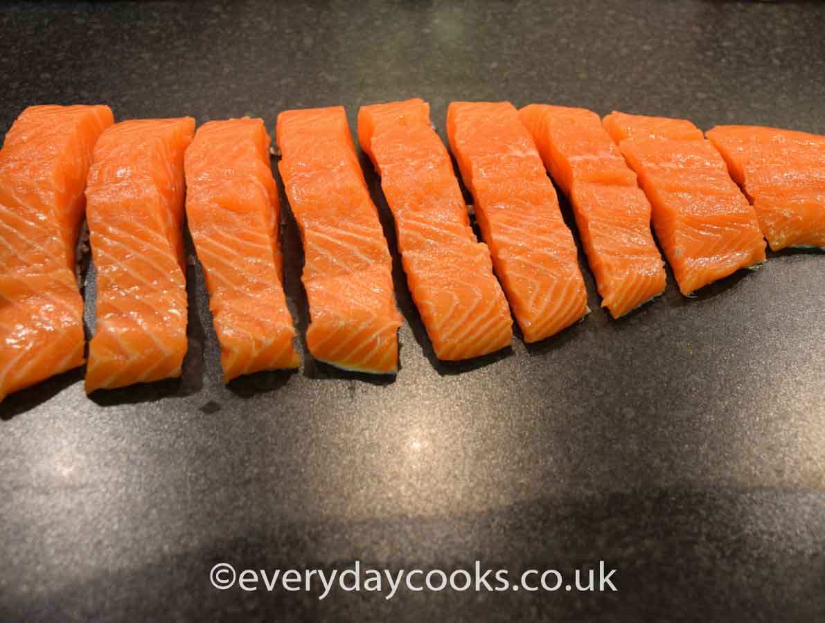 Uncooked side of salmon cut into fillets