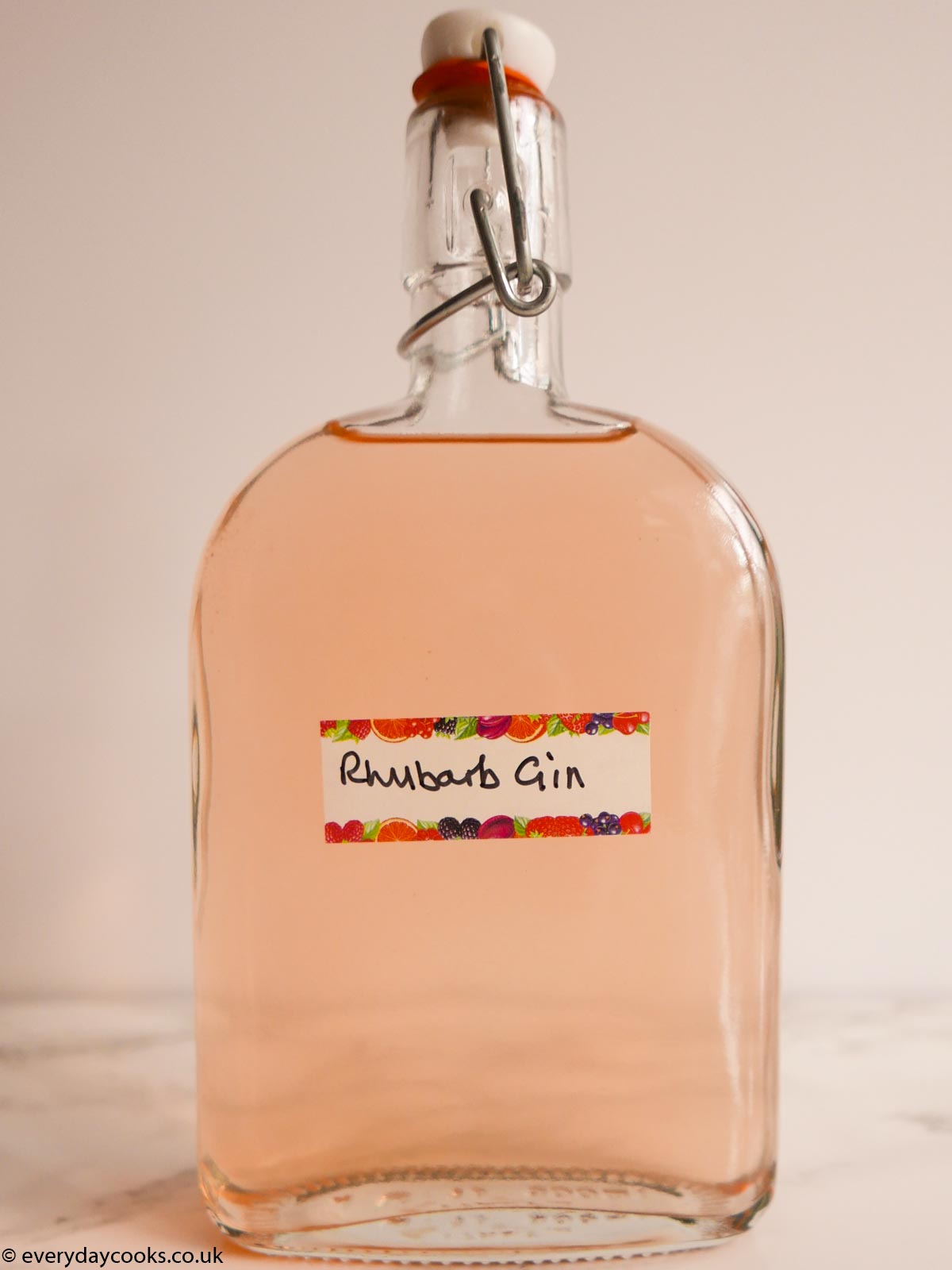 A half-litre bottle of rhubarb gin with a hand-written label