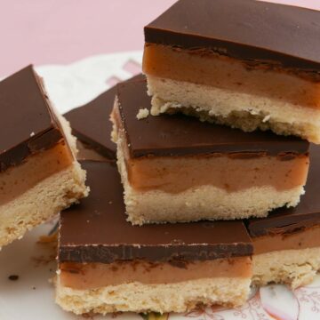 Pieces of millionaires shortbread balanced on top of each other.
