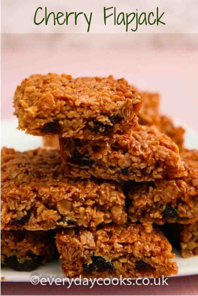 A stack of pieces of Cherry Flapjack on a white plate