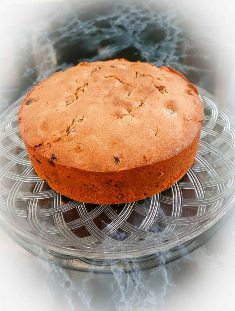 Christmas Cake on a glass plate waiting to be decorated