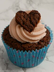 Chocolate Valentine cupcake with pink buttercream and a chocolate heart