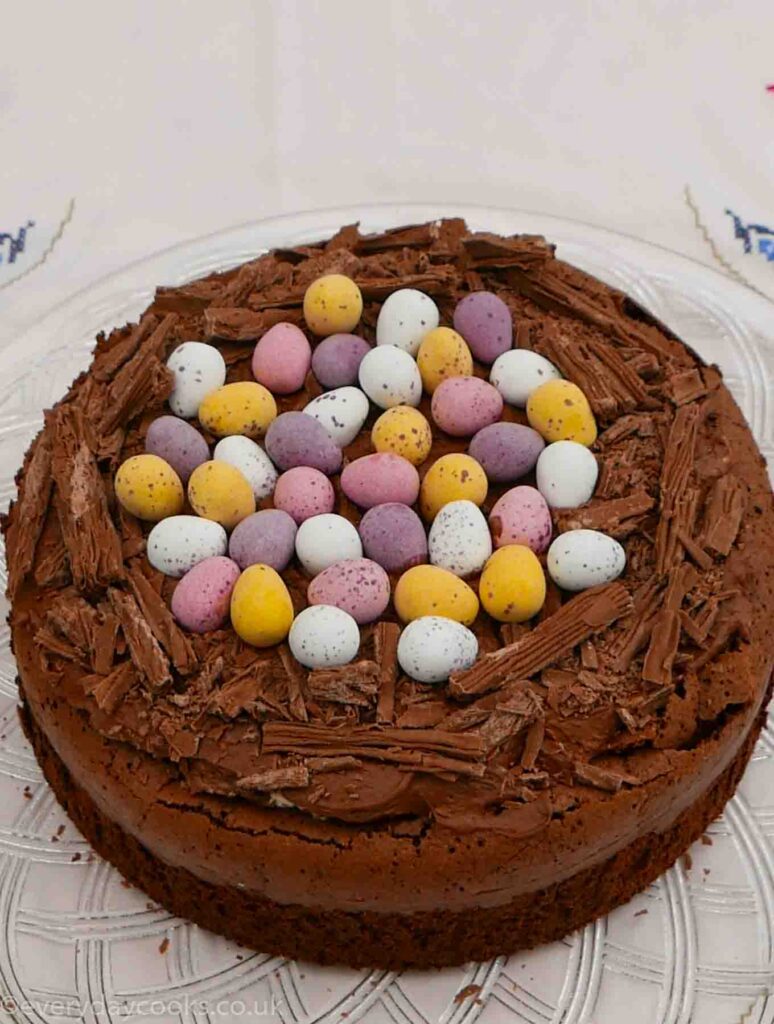 Chocolate Easter Nest Cake topped with chocolate cream and mini eggs