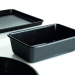 Black 2-pound loaf tin with other tins