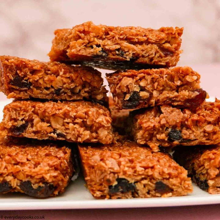 A stack of pieces of Cherry Flapjack on a white plate
