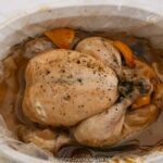 Slow Cooker Whole Chicken in a white dish