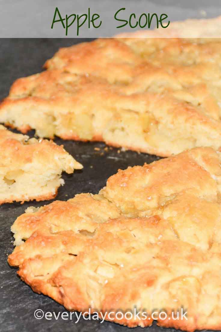 Apple scone on a slate with a slice pulled out