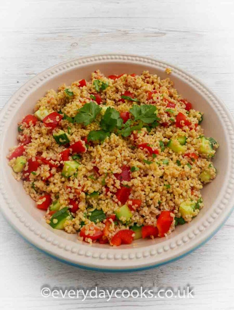 Cracked Wheat Salad in a serving dish with fresh herbs