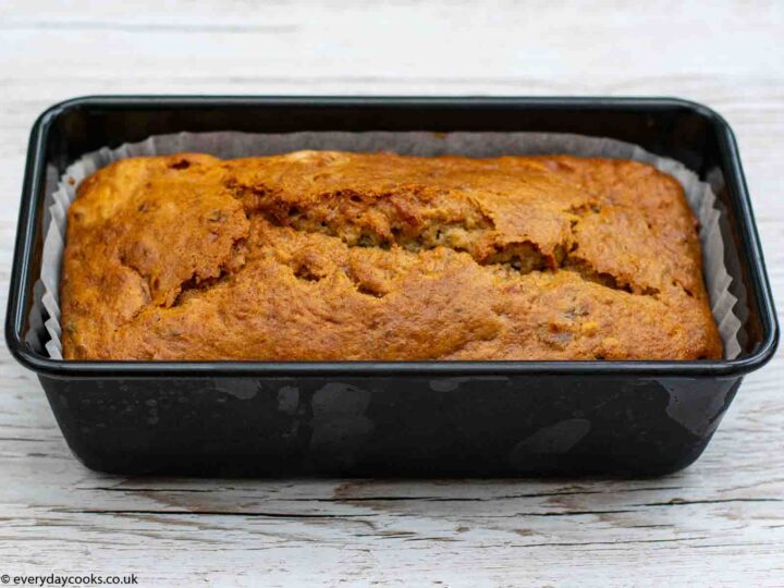 Lined loaf tin of cooked Banana Loaf cake