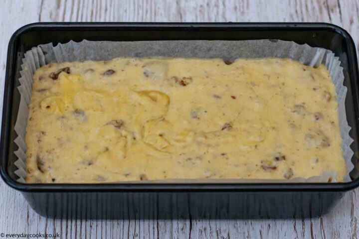 Lined loaf tin of uncooked Banana Loaf cake