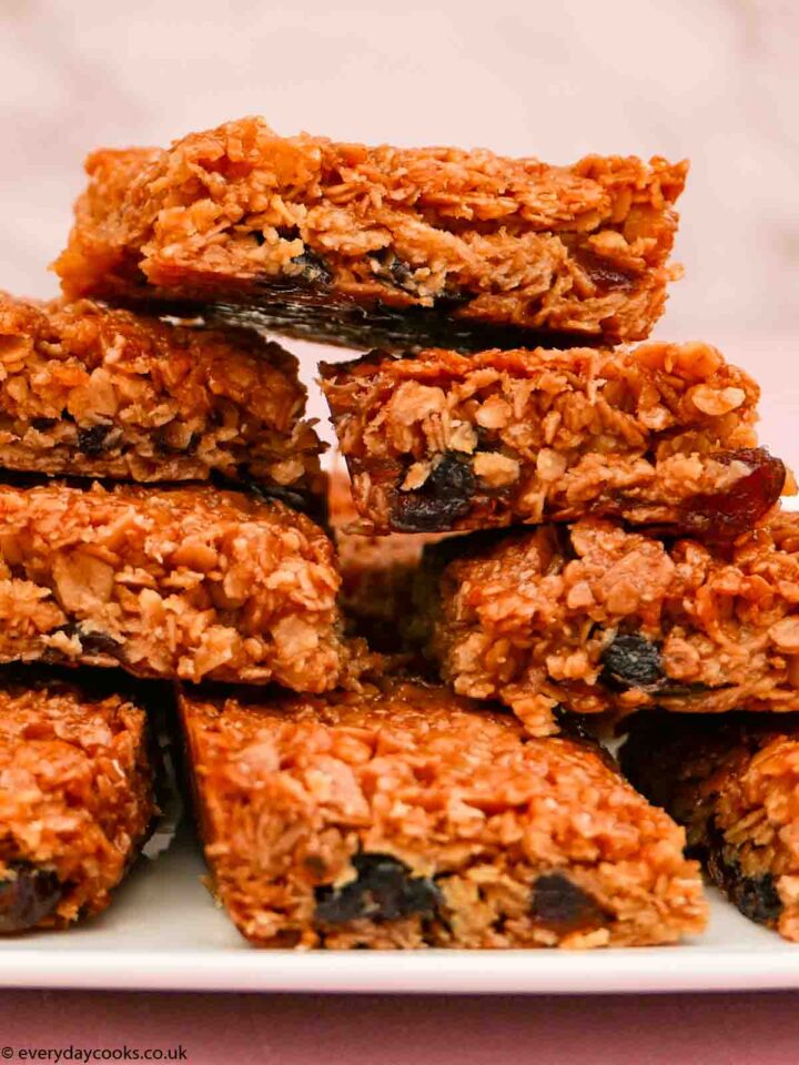 A stack of pieces of Cherry Flapjack on a white plate