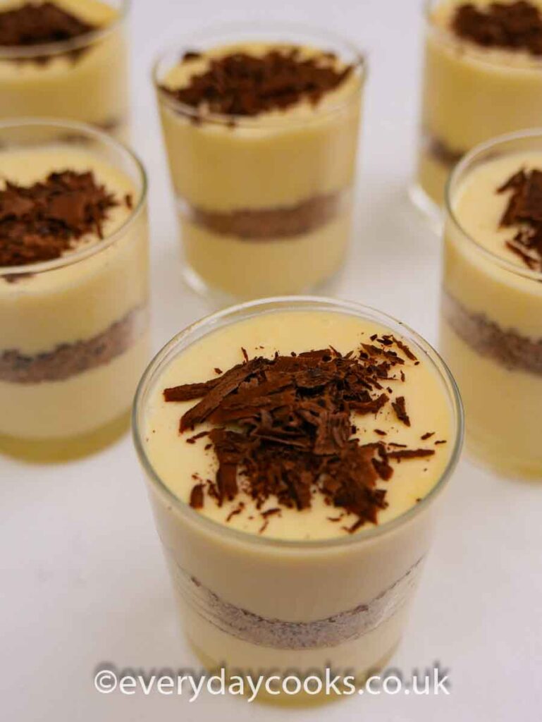 Six pots of Lemon Chocolate Dessert - layers of lemon mousse and chocolate crunch