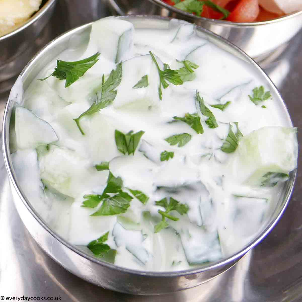 Cucumber Raita in a metal bowl