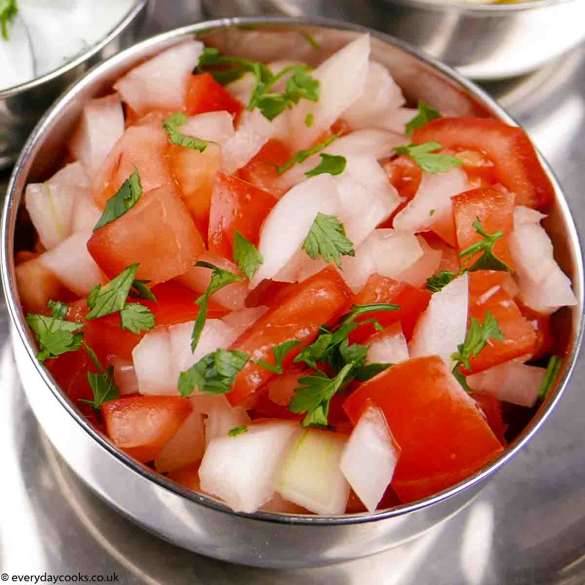  Onion and Tomato Salad in a metal bowl