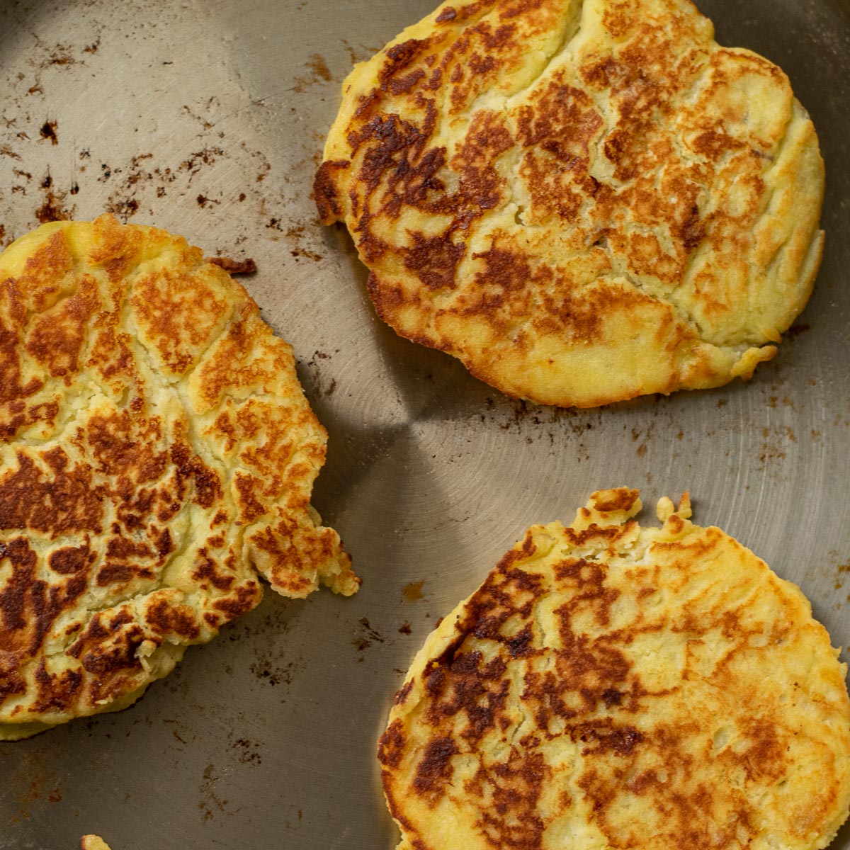 3 Banana Pancakes in a frying pan